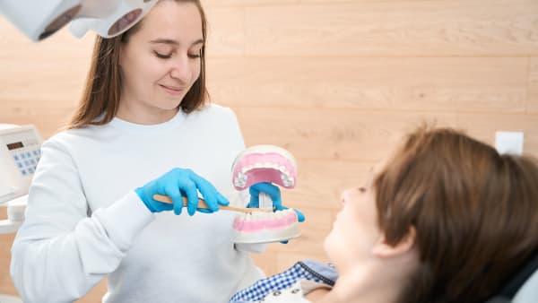 Visiting a dental hygienist or dental therapist