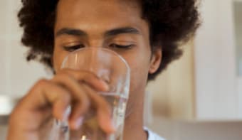 man drinking water